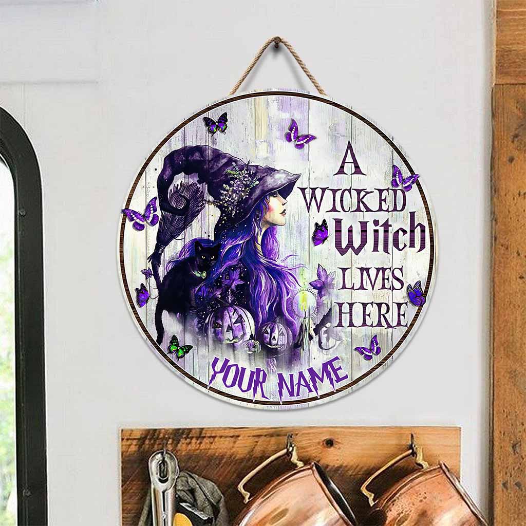 A Wicked Witch Lives Here Personalized Round Wood Sign