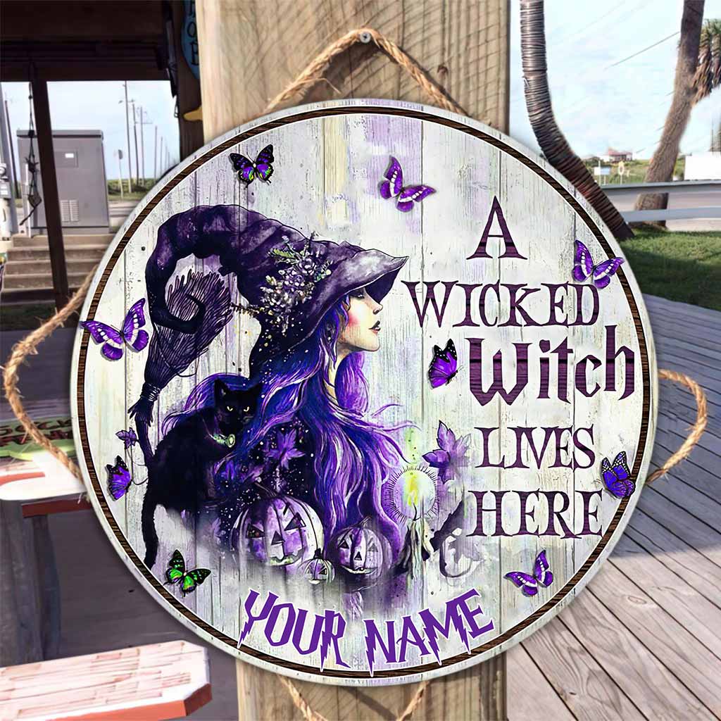 A Wicked Witch Lives Here Personalized Round Wood Sign