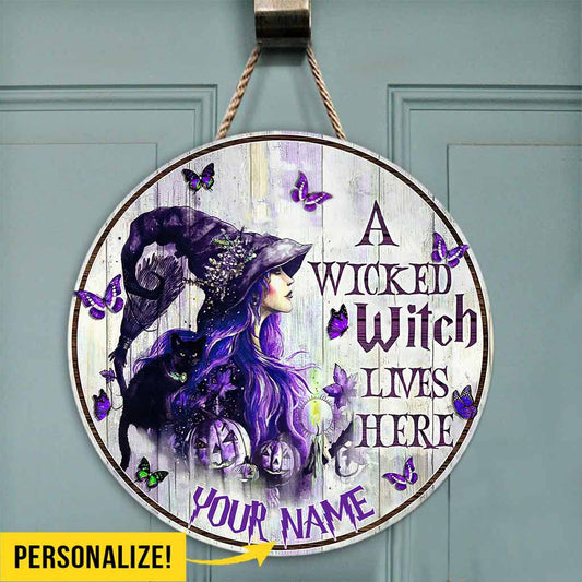 A Wicked Witch Lives Here Personalized Round Wood Sign